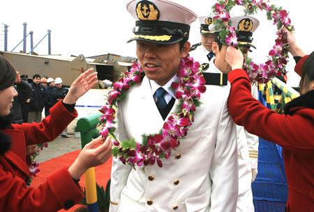 The crew members of the Chinese cargo ship Zhenhua 4 are greeted during a commendation ceremony at Changxing Island Port in Shanghai, east China, on January 23, 2009.