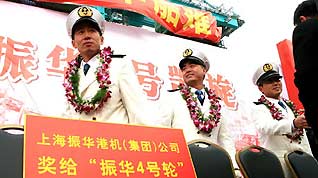 The crew members of the Chinese cargo ship Zhenhua 4 are seen during a commendation ceremony at Changxing Island Port in Shanghai, east China, on January 23, 2009.