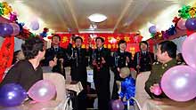 Railway policemen perform for travelers on a train on January 23, 2009. An evening party was held on board to celebrate the upcoming Spring Festival with travelers.