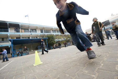 Gaza children have physical exercise class in the Beit Loliya Boys Elementary School in Gaza City on January 24, 2009. Some 200,000 Gaza children returned to school for the first time since Israel&apos;s offensive.