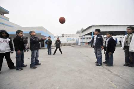 Gaza children play basketball during their break in the Beit Loliya Boys Elementary school in Gaza City on January 24, 2009. Some 200,000 Gaza children returned to school for the first time since Israel&apos;s offensive.