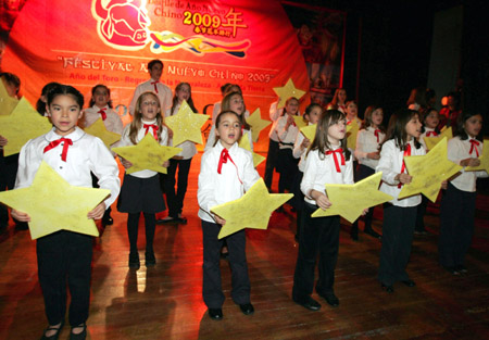 Mexican students perform a Chinese Spring Festival song in Mexico City, capital of Mexico, on January 23, 2009. Local municipality and Chinese league put on a party here on Friday to celebrate the incoming Spring Festival (Lunar New Year). 