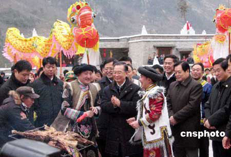 Chinese Premier Wen Jiabao (center) celebrates the traditional Spring Festival at a Qiang minority village in Beichuan, Sichuan Province, on Saturday, on January 24, 2009. 