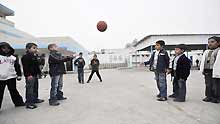 Gaza children play basketball during their break in the Beit Loliya Boys Elementary school in Gaza City on January 24, 2009. Some 200,000 Gaza children returned to school for the first time since Israel's offensive.