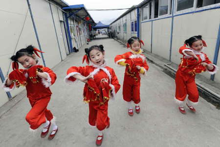 Four girls rehearse for a show celebrating the Spring Festival in Pengzhou, a quake-hit city of southwest China's Sichuan Province, on January 25, 2009. Quake zone residents in west China had made their own ways to welcome the Spring Festival, or the Chinese Lunar New Year.