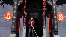 A girl sweeps the yard with festive decoration in Pingyao, a city of north China's Shanxi Province, on January 25, 2009.