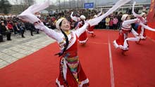 Locals perform folk dances celebrating the Spring Festival in Pengzhou, a quake-hit city of southwest China's Sichuan Province, on January 25, 2009.