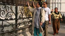 Tourists visit Swyambhu Nath Stupa, a Buddist holy palace and a famous tourist destination in Kathmandu, capital of Nepal, on January 24, 2009.