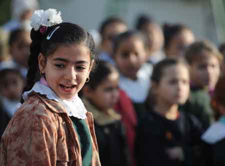 A Palestinian girl attends a group activity at a school in Bayt Lahiya, northern Gaza Strip, on January 27, 2009. Students in Gaza Strip are now receiving psychological treatment by group activities such as narrating, painting, singing and playing games, to foget pains and fears. [Xinhua]