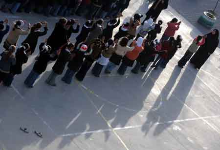 Palestinian students attend a group activity at a school in Bayt Lahiya, northern Gaza Strip, on January 27, 2009. [Xinhua]