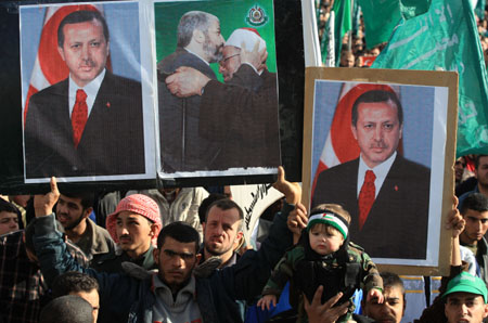 Portraits of Turkish Prime Minister Tayyip Erdogan are seen during a rally held by supporters of Hamas in Gaza City, on January 30, 2009.