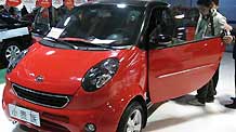 Visitors check a minicar in an auto trade market in Beijng, capital of China, on January 30, 2009. Many Chinese chose Spring Festival holidays to select and buy cars as the central government released automotive industry boosting plan in the middle of January.