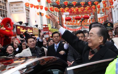 Chinese Premier Wen Jiabao (R Front) meets with overseas Chinese and send greetings to them for the Chinese lunar New Year in the Chinatown of London January 31, 2009. Chinese Premier Wen Jiabao arrived in London on January 31 for a three-day visit to Britain.