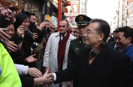 Chinese Premier Wen Jiabao (R Front) meets with overseas Chinese and send greetings to them for the Chinese lunar New Year in the Chinatown of London on January 31, 2009. Chinese Premier Wen Jiabao arrived in London on January 31 for a three-day visit to Britain.