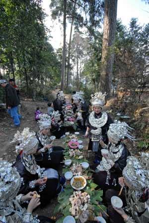 Women of Miao ethnic group have a diner in the Zhanliu Village of Jianhe County, southwest China's Guizhou Province, on January 31, 2009.