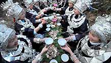 Women of Miao ethnic group toast at a diner in the Zhanliu Village of Jianhe County, southwest China's Guizhou Province, on January 31, 2009.