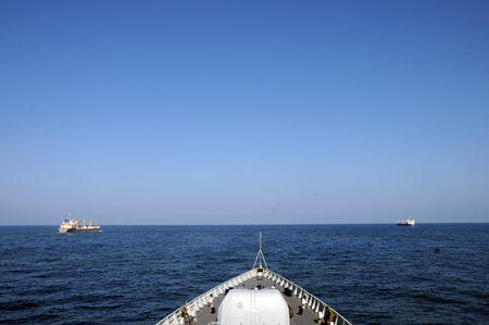 Photo taken from the deck of Chinese destroyer Wuhan shows two merchant vessels &apos;Lemin&apos; and &apos;Lianhuahai&apos; sailing by the escort of Chinese navy to pass through the Gulf of Aden, on February 1, 2009. The Chinese naval fleet started carrying out the 15th batch of escort missions against pirates on February 1.