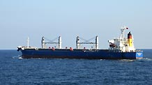 Crew members on the merchant vessel 'Lianhuahai' welcome the Chinese navy which will escort it to pass through the Gulf of Aden, on February 1, 2009. The Chinese naval fleet started carrying out the 15th batch of escort missions against pirates on February 1.