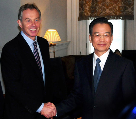 Chinese Premier Wen Jiabao (R) shakes hands with former British Prime Minister Tony Blair during their meeting in London on February 1, 2009. Wen is on a three-day official visit to Britain, the last leg of his week-long European tour.