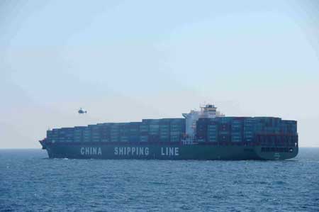 A helicopter sent by Chinese destroyer Wuhan takes supplies from Chinese merchant ship Xin Fei Zhou in the Gulf of Aden, on January 31, 2009.