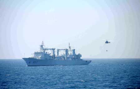 A helicopter with supplies flies towards the Chinese supply ship Weishanhu in the Gulf of Aden, on January 31, 2009.