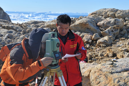 Chinese researchers use a total station to measure the movement of the Dulk glacier in Antarctica on January 31, 2009. The glacier has flowed 150 meters into the ocean over the past year, according to their study.