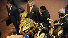 Libyan leader Muammar al-Qathafi(C) arrives at the conference center of the United Nations' Economic Commission of Africa(ECA) prior to the opening ceremony of the 12th AU Summit in Addis Ababa, capital of Ethiopia, on February 2, 2009.
