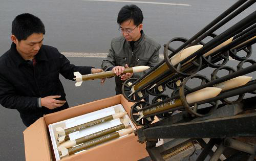 Meteorological bureau working staffs of Linfen City in Shanxi Province install the rocket to increase raining on Monday, on February 2, 2009. Under favor of a light rain that fell on Monday in the city, local meteorological authorities used the rain-increasing rocket to relieve drought.