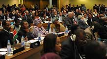 Delegates react during the opening ceremony of the 12th AU summit at the conference center of the United Nations' Economic Commission of Africa(ECA) in Addis Ababa, capital of Ethiopia, on February 2, 2009.
