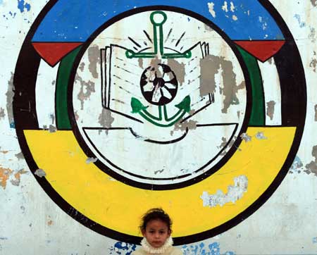 A Palestinian who lost her home during the 22-day Israeli offensive is seen at a United Nations club in al-Shati refugee camp on February 2, 2009.