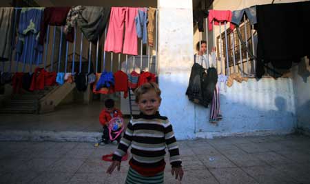 Palestinians who lost their homes during the 22-day Israeli offensive are seen at a United Nations club in al-Shati refugee camp on February 2, 2009.