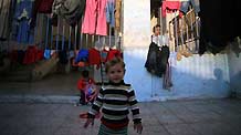 Palestinians who lost their homes during the 22-day Israeli offensive are seen at a United Nations club in al-Shati refugee camp on February 2, 2009.