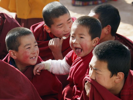 Young ethnic Tibetan monks attend a prayer meeting at a monastery in Tongren, northwest China's Qinghai province Monday February 2, 2009. 