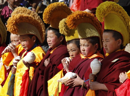 Young ethnic Tibetan monks attend a prayer meeting at a monastery in Tongren, northwest China's Qinghai province Monday February 2, 2009. 