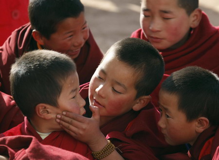 Young ethnic Tibetan monks attend a prayer meeting at a monastery in Tongren, northwest China's Qinghai Province on Monday, on February 2, 2009.