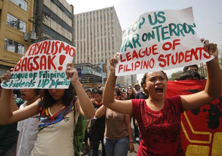 Protestors, mostly students, shout slogans during a rally outside the US embassy in Manila, Philippines, on February 3, 2009.