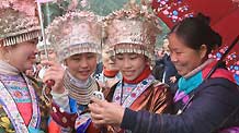 Girls of Miao ethnic group check pictures taken by the cellphone in the Hongshui Village of Rongshui Miao Autonomous County, southwest China's Guangxi Zhuang Autonomous Region, on February 4, 2009, the Spring Begins, first of the 24 solar terms in China's lunar calendar. Residents of Miao ethnic group celebrated the Begin of Spring by various activities, such as Lusheng (a reed-pipe Bamboo-cluster flute) Dance and Lusheng blowing on Wednesday.