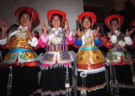 Tibetan residents perform celebrating traditional new year, in Tibetan autonomous prefecture of Diqing, southwest China's Yunnan Province, on February 7, 2009. Tibetans danced and sang celebrating the new year according to the local Tibetan calendar which falls on February 25.