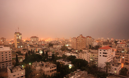 Lightning flashes above Gaza city as the first rain of this year starts to fall on February 10, 2009.