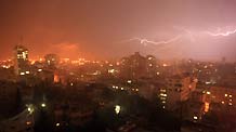 Lightning flashes above Gaza city as the first rain of this year starts to fall on February 10, 2009.