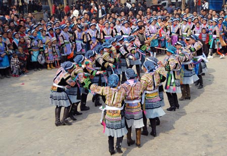 People of Miao ethnic group dance during a cultural activity held in Pingpo Village of Longli County, southwest China's Guizhou Province, on February 14, 2009. Local people of Miao ethnic group gathered here to celebrate an annual cultural activity on Saturday.