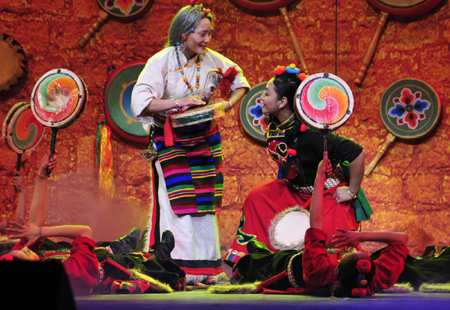 Tibetan artists in traditional costumes stage Tibetan dance during a rehearsal for the grand party scheduled to open on February 24 to celebrate the upcoming Tibetan New Year, the year of Ox, in Lhasa, capital of sotuhwest China's Tibet Autonomous Region, on February 14, 2009.