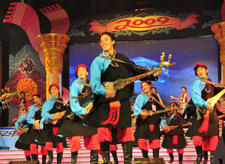 Tibetan artists in traditional costumes stage Tibetan dance during a rehearsal for the grand party scheduled to open on February 24 to celebrate the upcoming Tibetan New Year, the year of Ox, in Lhasa, capital of sotuhwest China's Tibet Autonomous Region, on February 14, 2009. 