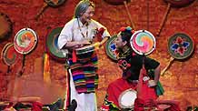 Tibetan artists in traditional costumes stage Tibetan dance during a rehearsal for the grand party scheduled to open on February 24 to celebrate the upcoming Tibetan New Year, the year of Ox, in Lhasa, capital of sotuhwest China's Tibet Autonomous Region, on February 14, 2009.