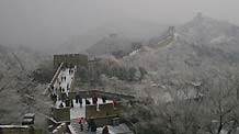 People visit the snow-covered Badaling section of the Great Wall in Beijing, capital of China, on February 18, 2009. The first snowfall hitting Beijing this year continued on Wednesday morning.