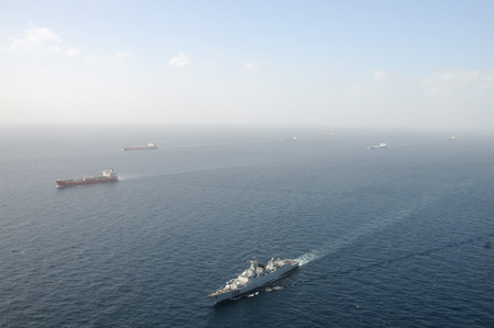 The &apos;Wuhan&apos; vessel of the Chinese navy (Below) escorts merchant vessels in the Gulf of Aden, on February 17, 2009.