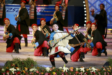 Tibetan actors perform dance at a gala to celebrate the Tibetan New Year in Lhasa, capital of southwest China's Tibet Autonomous Region, on February 18, 2009. A grand gala, featuring with typical Tibetan dancing and singing, was held here on Wednesday, to celebrate the upcoming Tibetan New Year, which falls on February 25 this year.