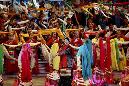 Tibetan artists in traditional costumes perform dance at a gala to celebrate the Tibetan New Year in Lhasa, capital of southwest China's Tibet Autonomous Region, on February 18, 2009. 