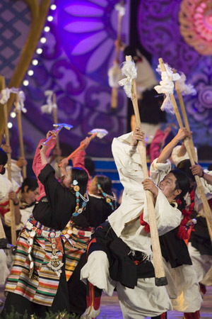 Tibetan artists in traditional costumes perform dance at a gala to celebrate the Tibetan New Year in Lhasa, capital of southwest China's Tibet Autonomous Region, on February 18, 2009. 