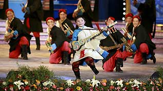 Tibetan actors perform dance at a gala to celebrate the Tibetan New Year in Lhasa, capital of southwest China's Tibet Autonomous Region, on February 18, 2009. A grand gala, featuring with typical Tibetan dancing and singing, was held here on Wednesday, to celebrate the upcoming Tibetan New Year, which falls on February 25 this year.